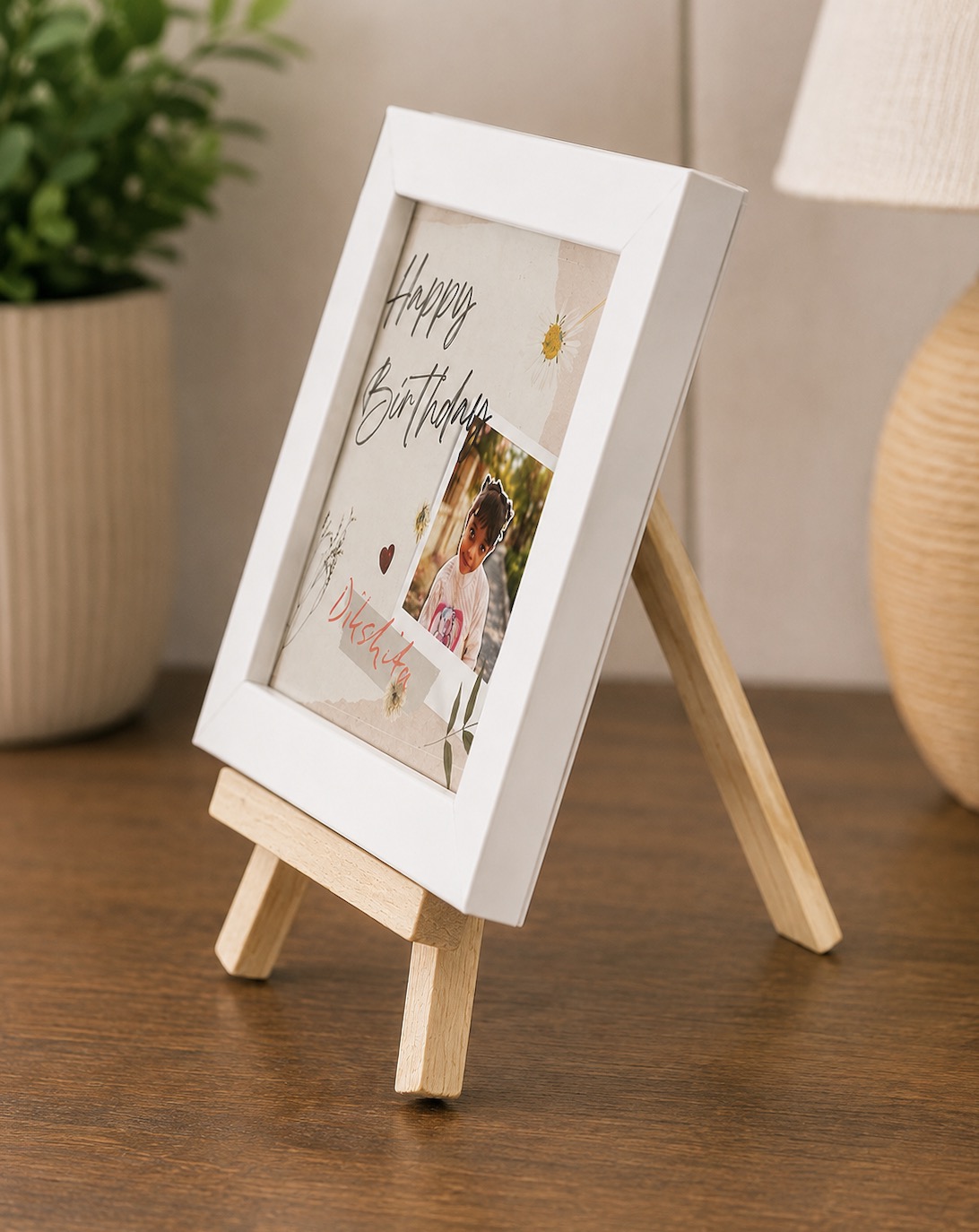 Side view showing the adjustable wooden tri-stand behind the white photo frame